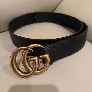 Black leather Gucci belt with gold hardware